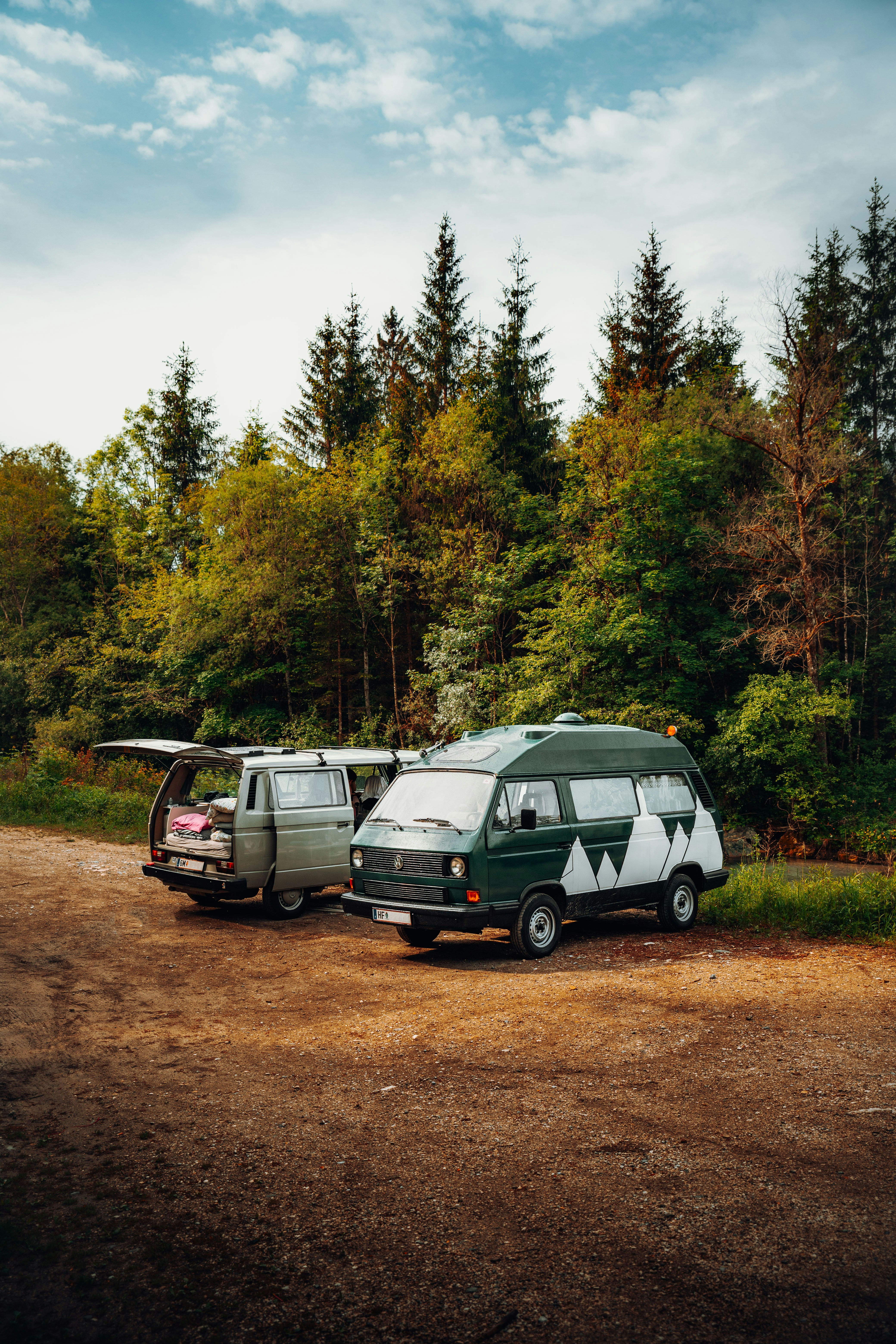 white and black van on dirt road